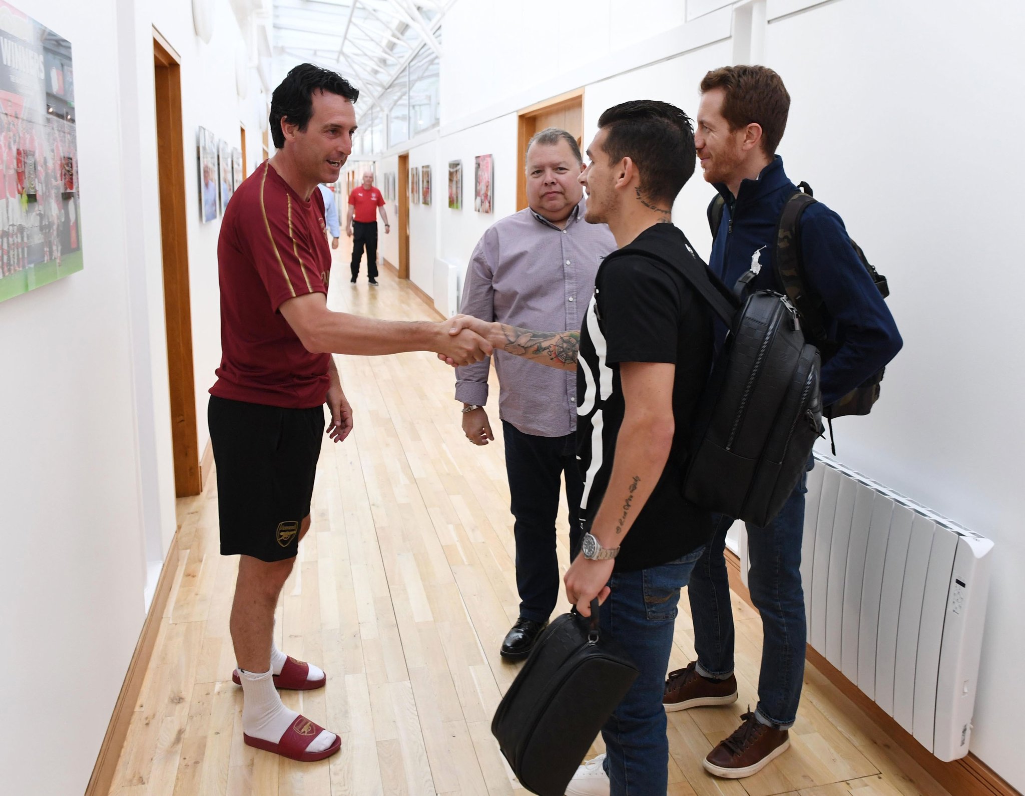 Arsenal midfielder Lucas Torreira meets Unai Emery
