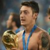 Mesut Ozil with the World Cup trophy