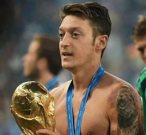 Mesut Ozil with the World Cup trophy