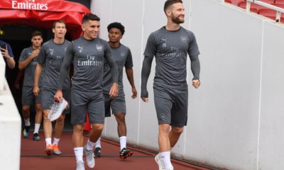 Arsenal players entering the pitch